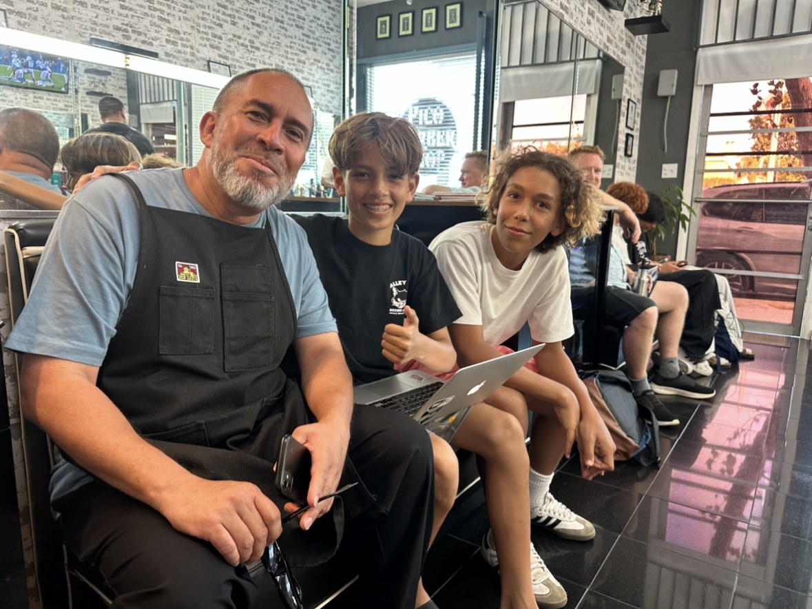 Working on a site at a barbershop with the owner