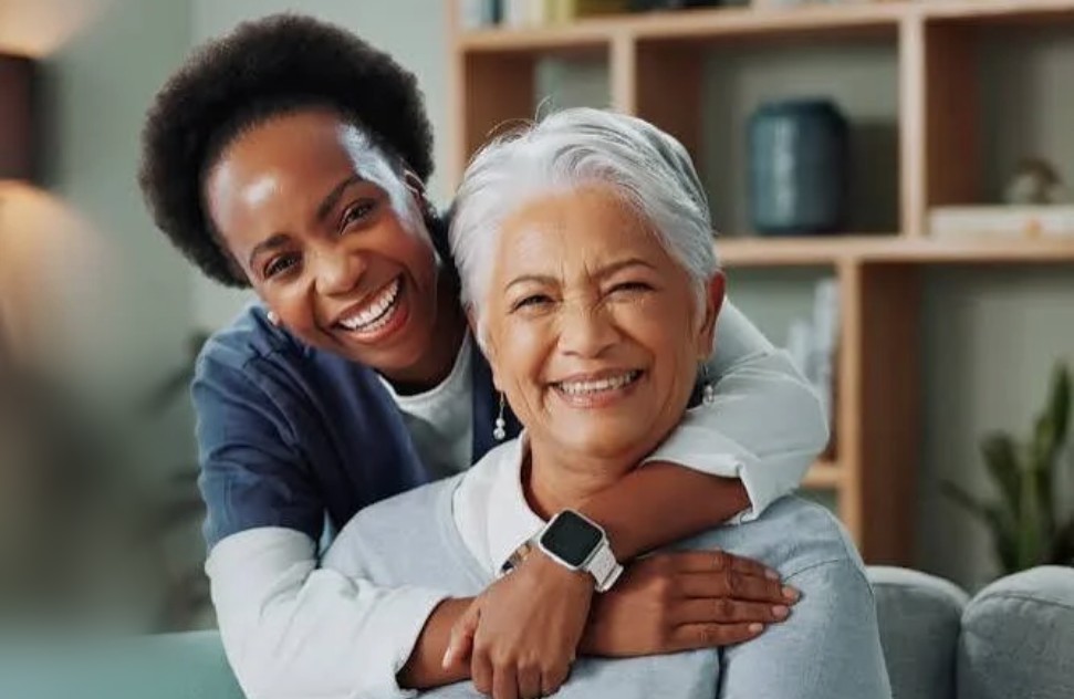 A caregiver sharing a joyful moment with her client