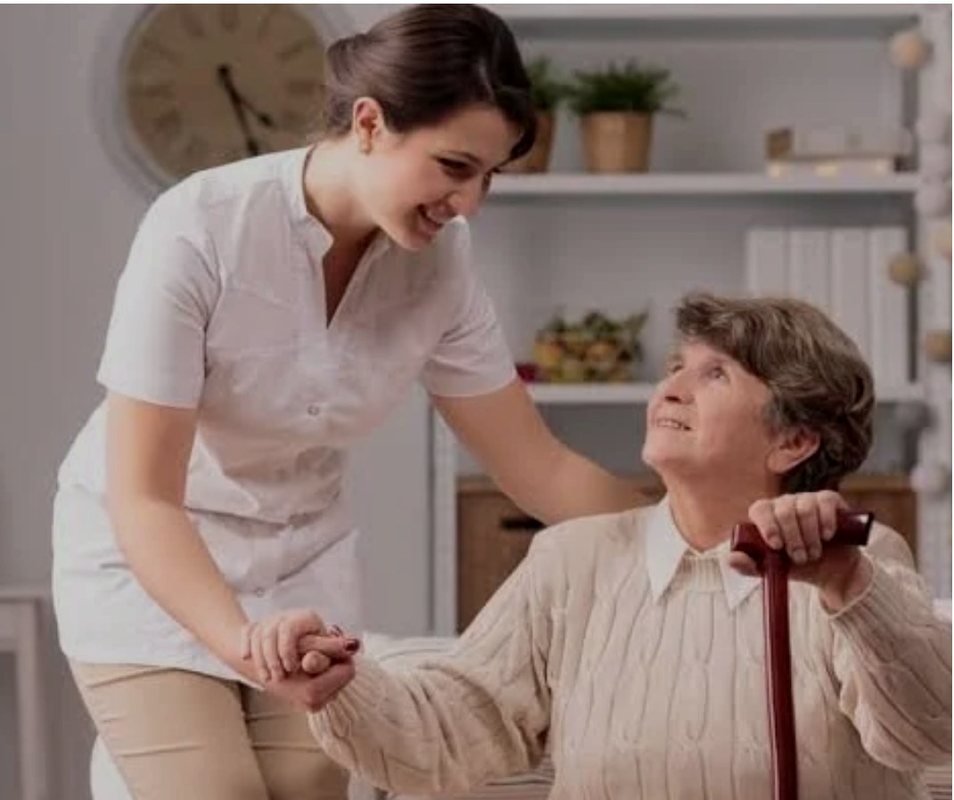 A caregiver helping a client at home